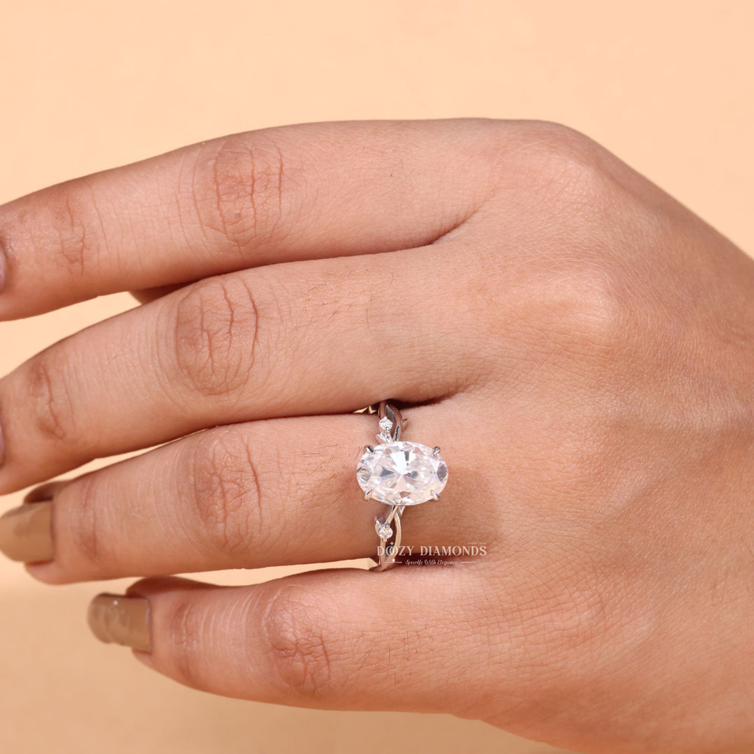 Detailed close-up of oval solitaire diamond engagement ring