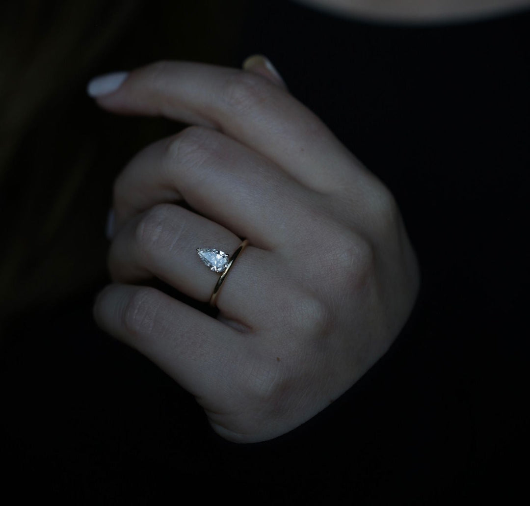 Top-down view of pear cut solitaire engagement ring