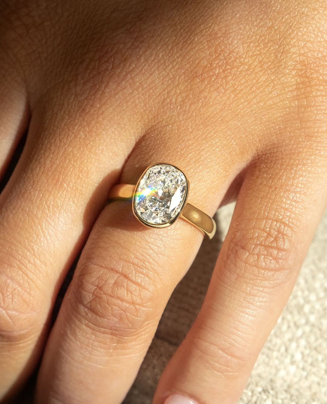 Unboxing view of cushion cut bezel diamond engagement ring