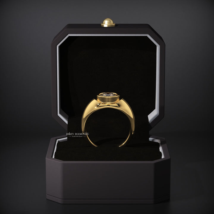 Certified round cut diamond featured in bezel engagement ring