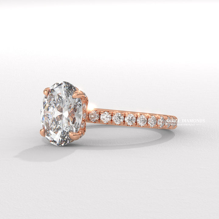 Oval cut hidden halo engagement ring shown in real-life wear