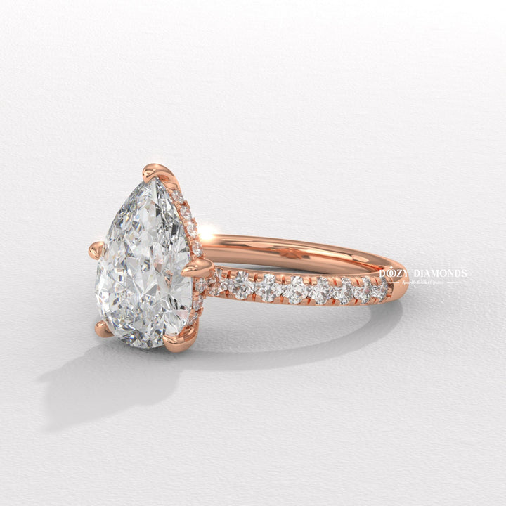 Close-up of pear cut center diamond in solitaire engagement ring