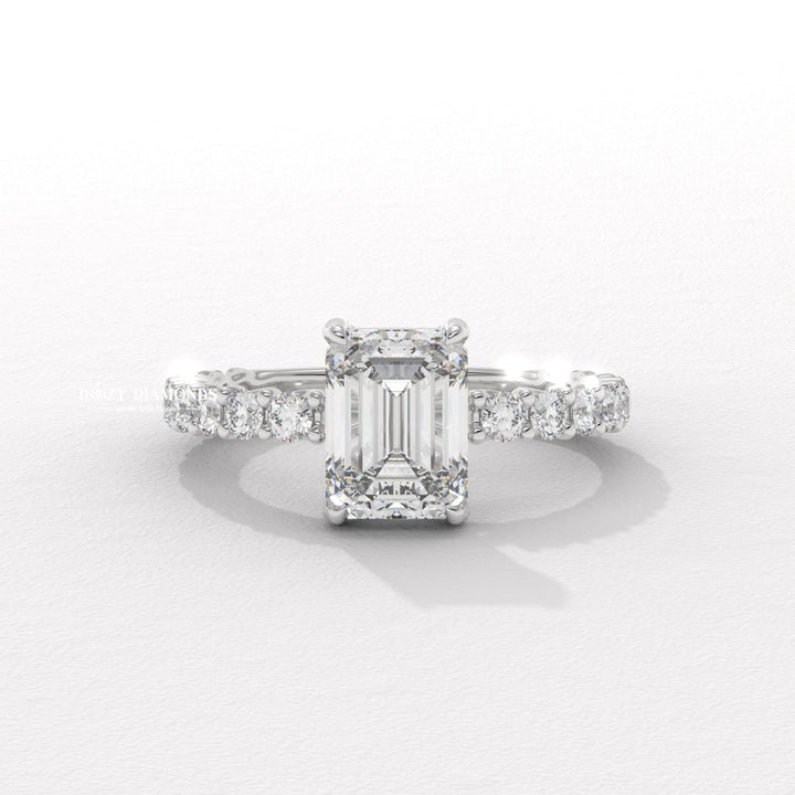 Profile view of emerald cut pave engagement ring band