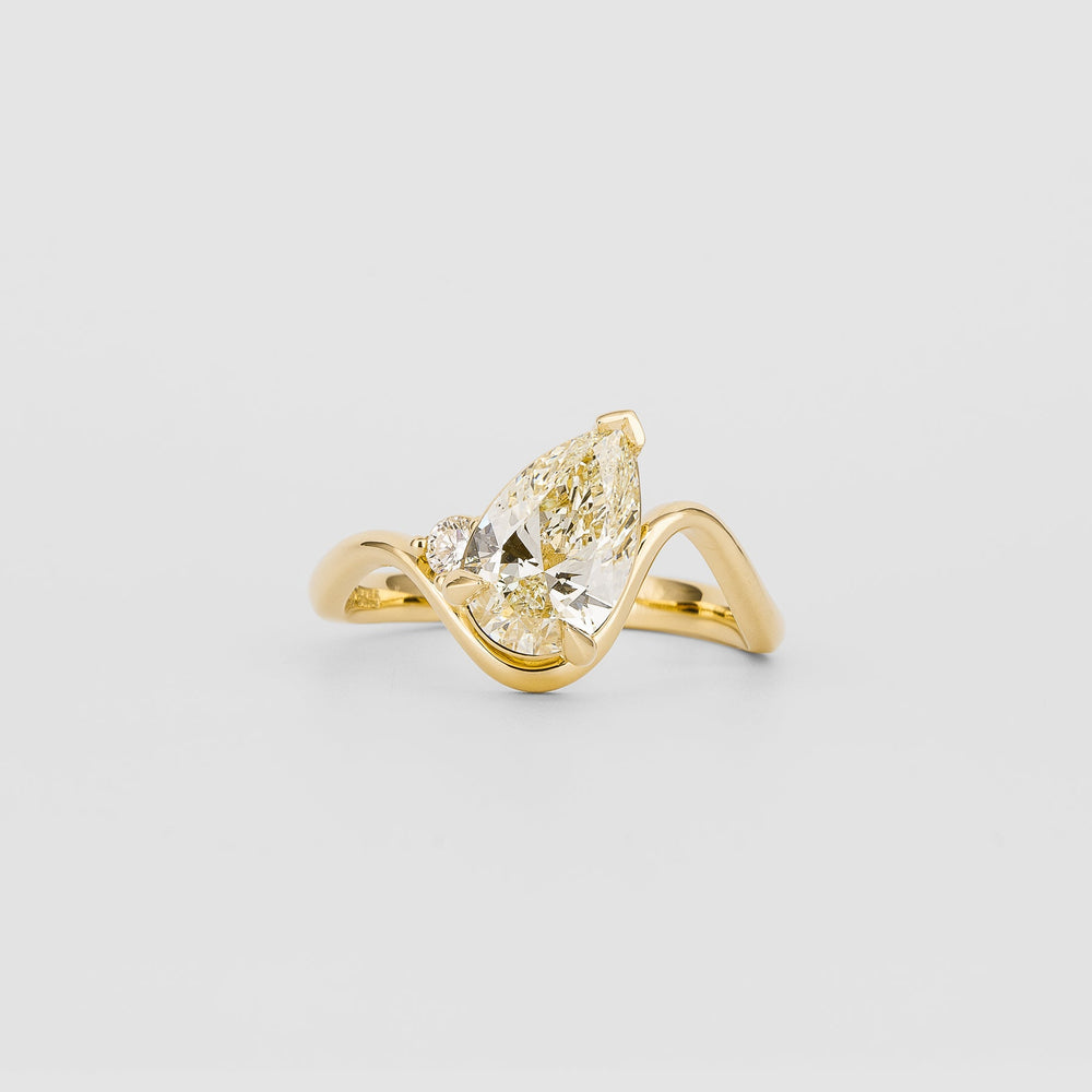Side angle of pear solitaire diamond engagement ring