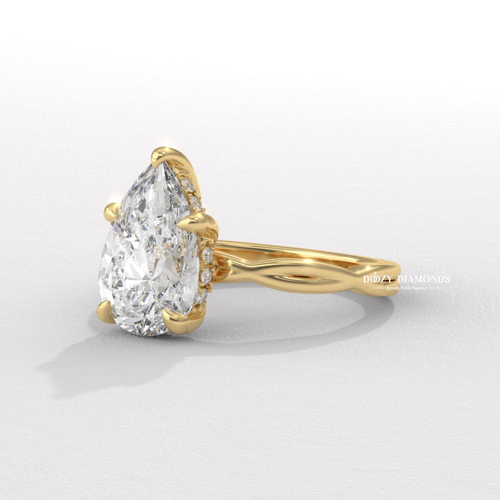 Pear cut engagement ring side view showing band detail