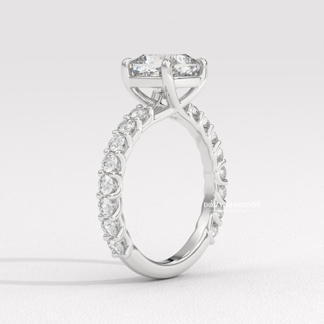 Cushion cut engagement ring shown with authenticity certificate