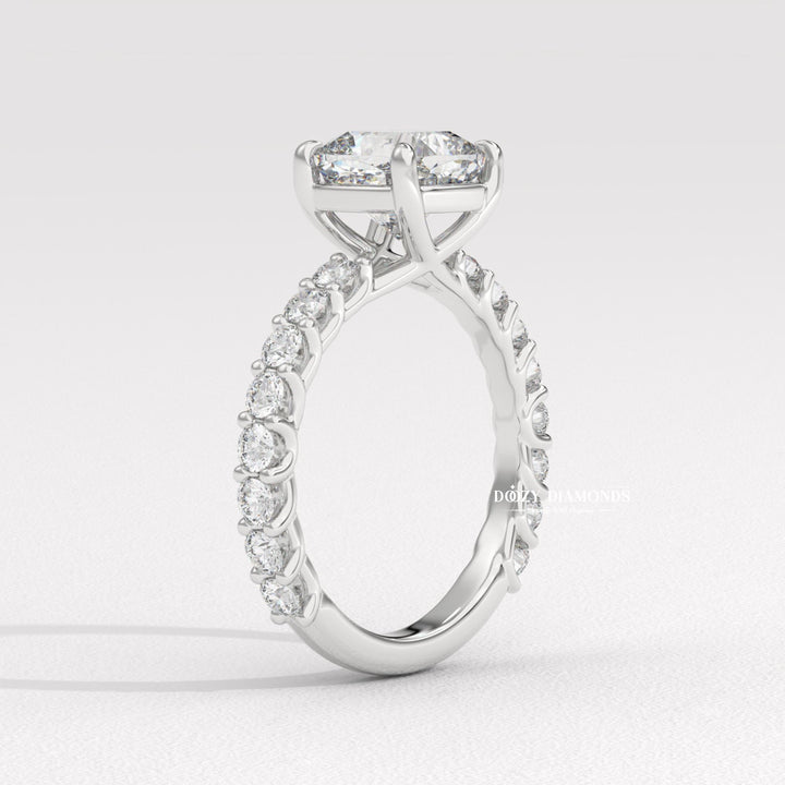 Cushion cut engagement ring shown with authenticity certificate