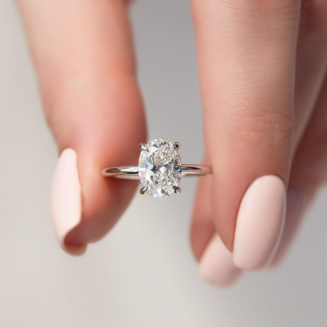 Shop oval hidden halo lab grown diamond engagement ring