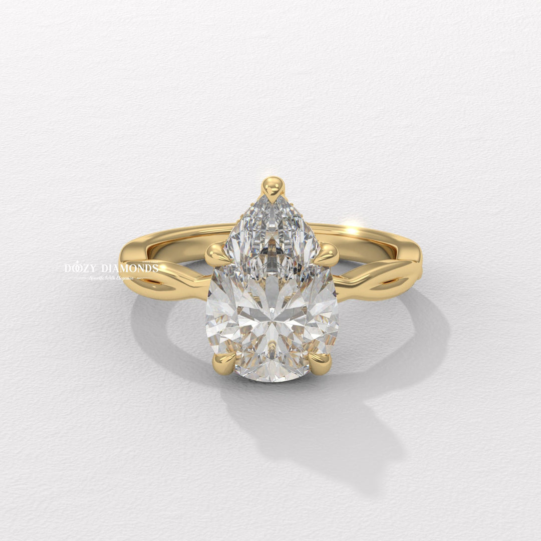 Pear cut solitaire engagement ring available to buy now