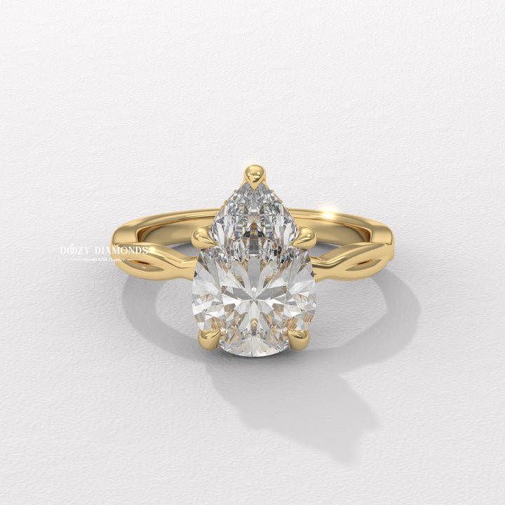 Pear cut solitaire engagement ring available to buy now