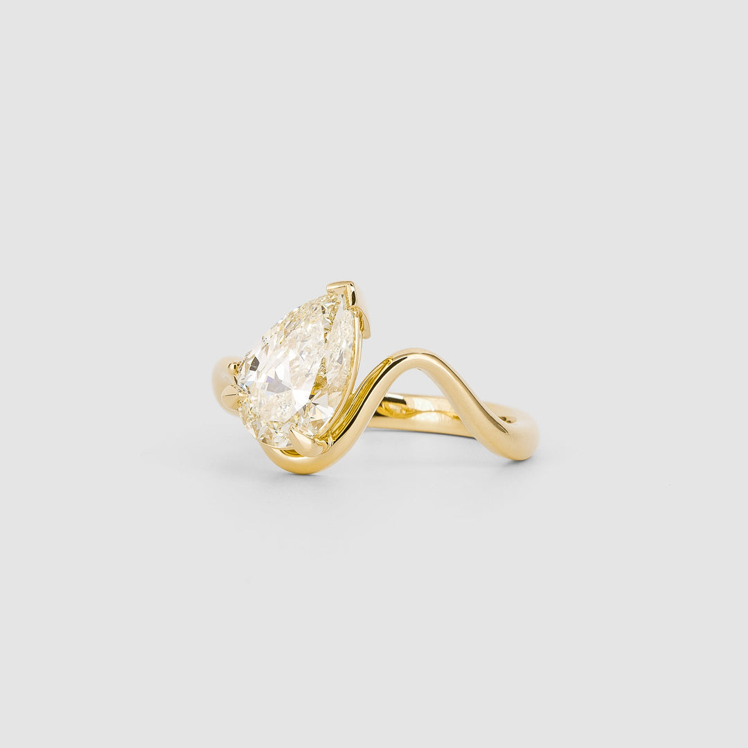 Profile view of pear cut solitaire engagement ring band