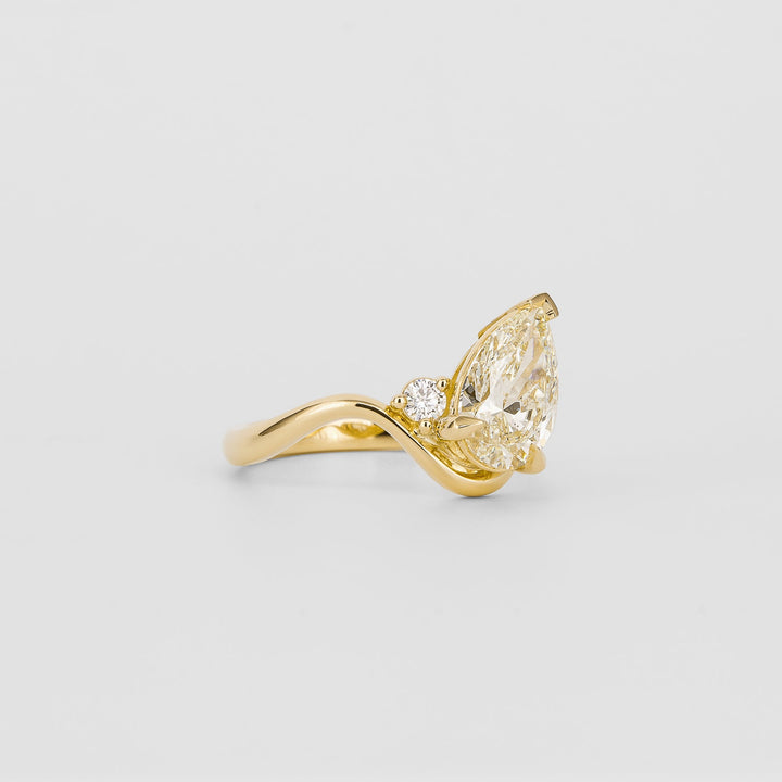 Pear solitaire engagement ring viewed from the side