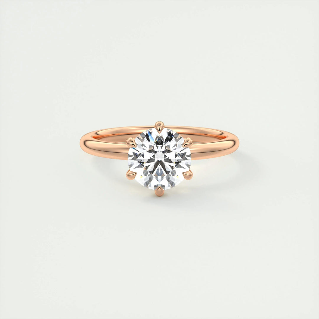 Round solitaire engagement ring viewed from the side