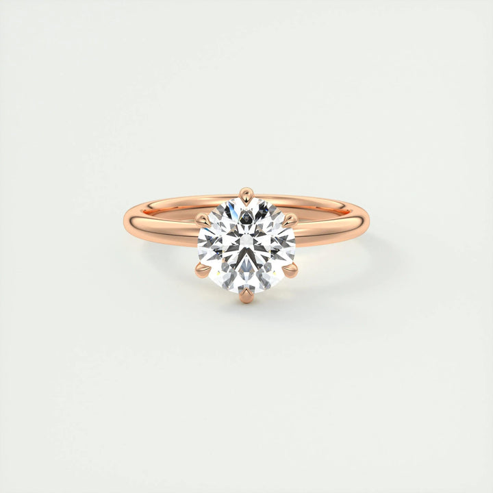 Round solitaire engagement ring viewed from the side