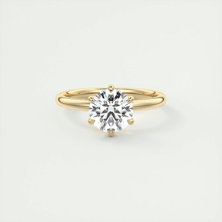 Close-up of round cut center diamond in solitaire engagement ring