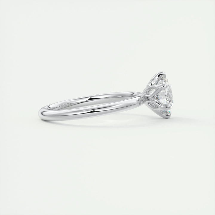 Round solitaire engagement ring photographed in natural light