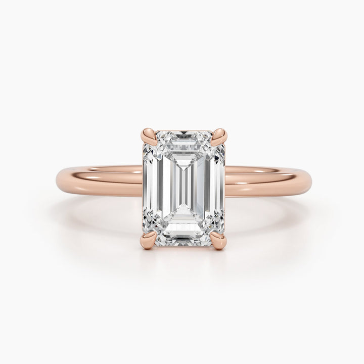 Detailed close-up of emerald solitaire diamond engagement ring