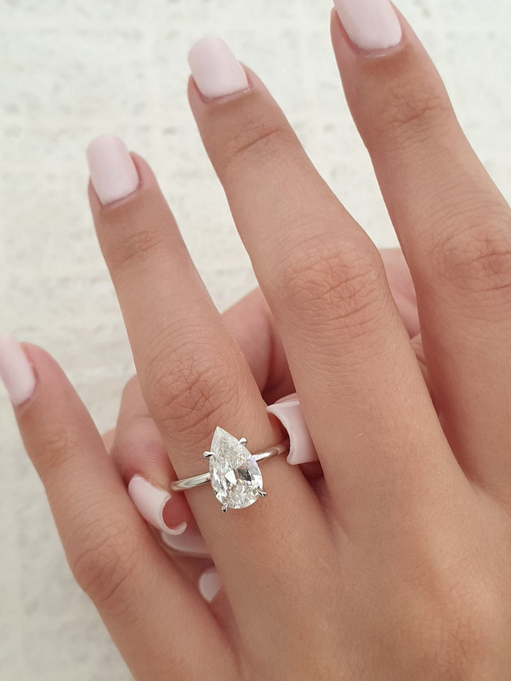 Handcrafted pear cut hidden halo lab grown diamond engagement ring