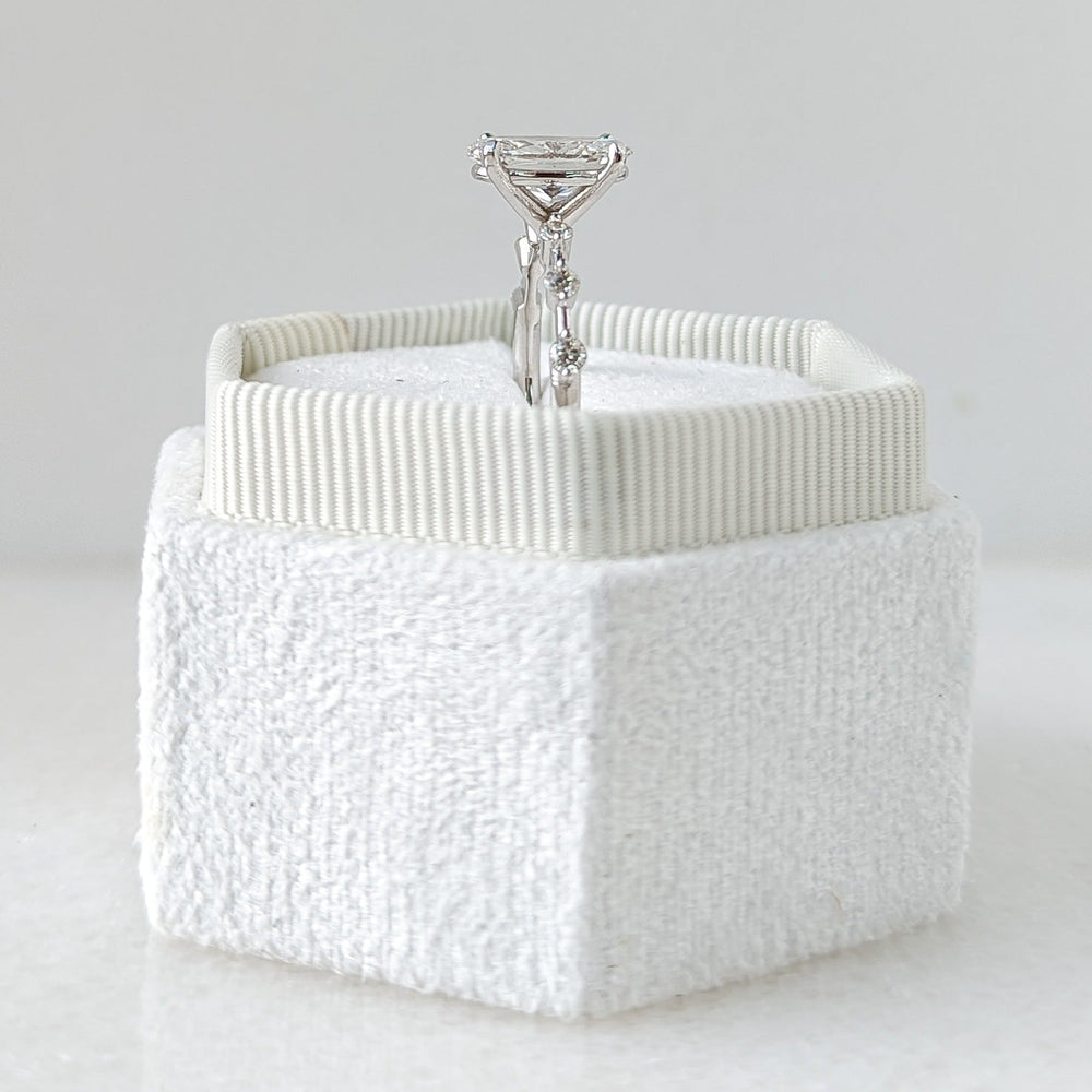 Unboxing view of oval cut pave diamond engagement ring