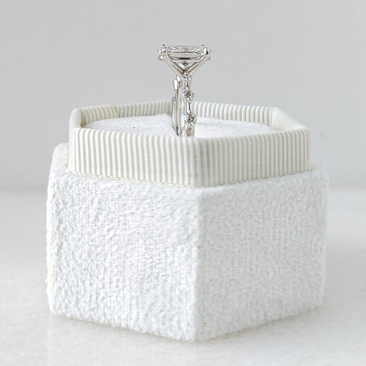 Unboxing view of oval cut pave diamond engagement ring