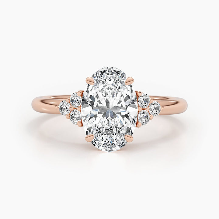 Oval cluster diamond ring displayed on jewelry stand