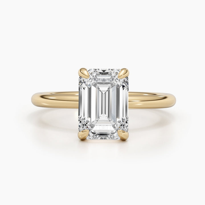 Macro shot of emerald cut diamond facets in solitaire ring setting