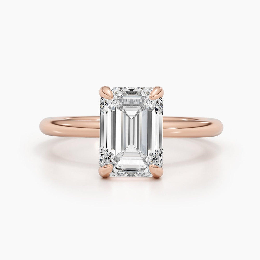 Detailed close-up of emerald solitaire diamond engagement ring