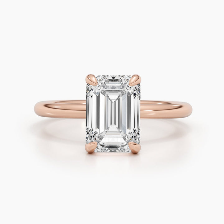 Detailed close-up of emerald solitaire diamond engagement ring