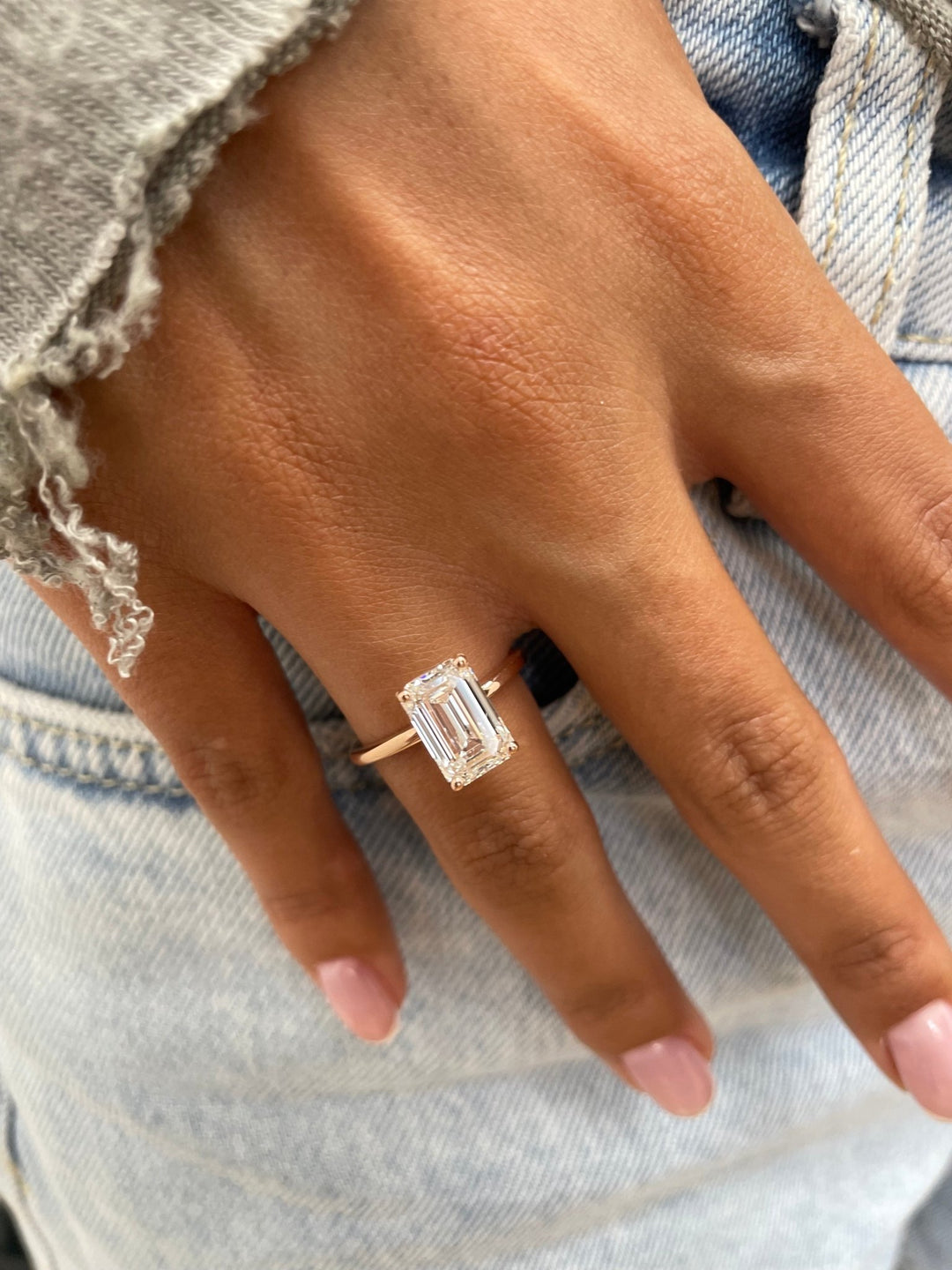 Emerald solitaire lab grown diamond ring side profile in gold setting