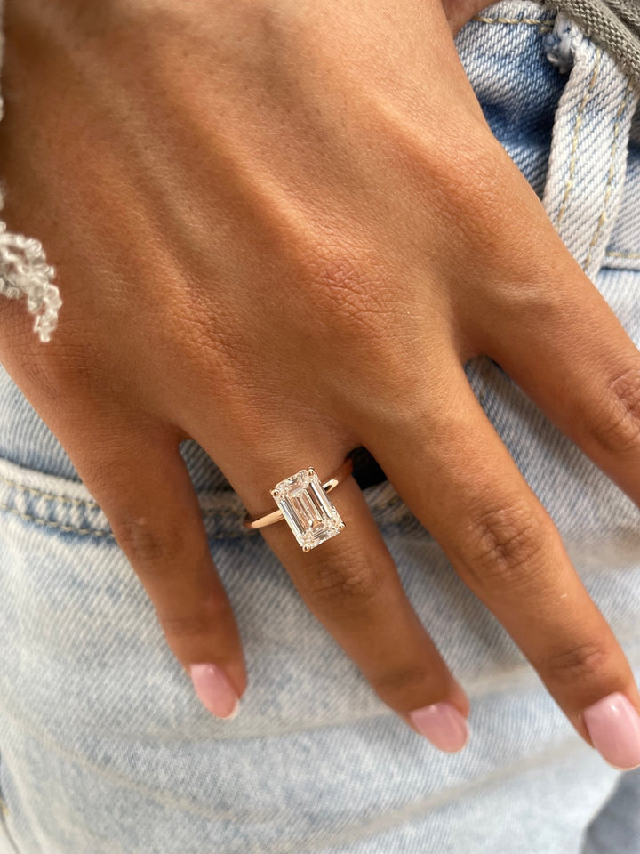 Emerald cut engagement ring side view showing band detail
