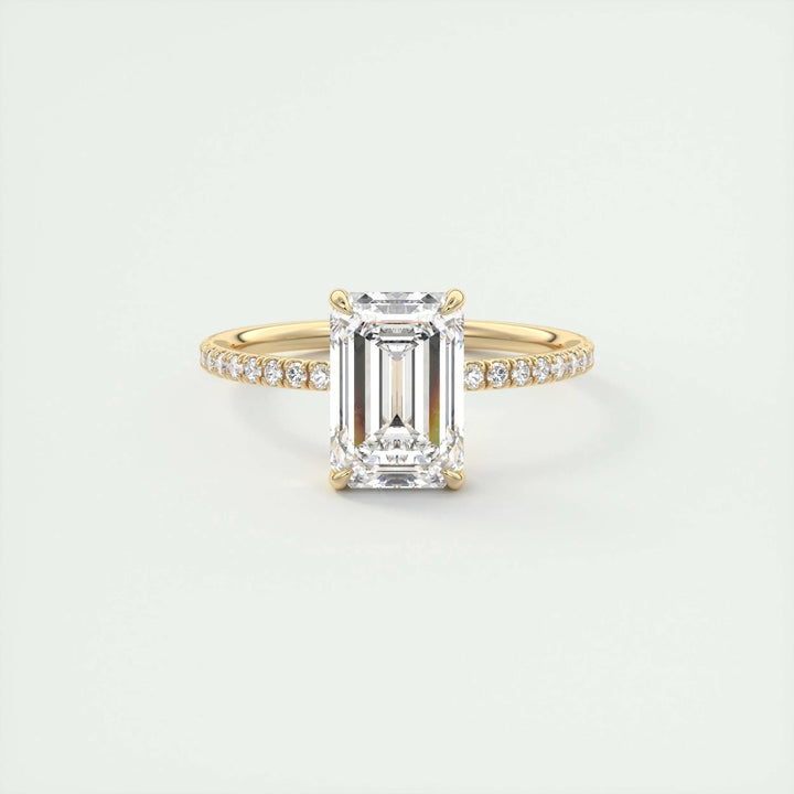 Fine craftsmanship detail on emerald pave engagement ring