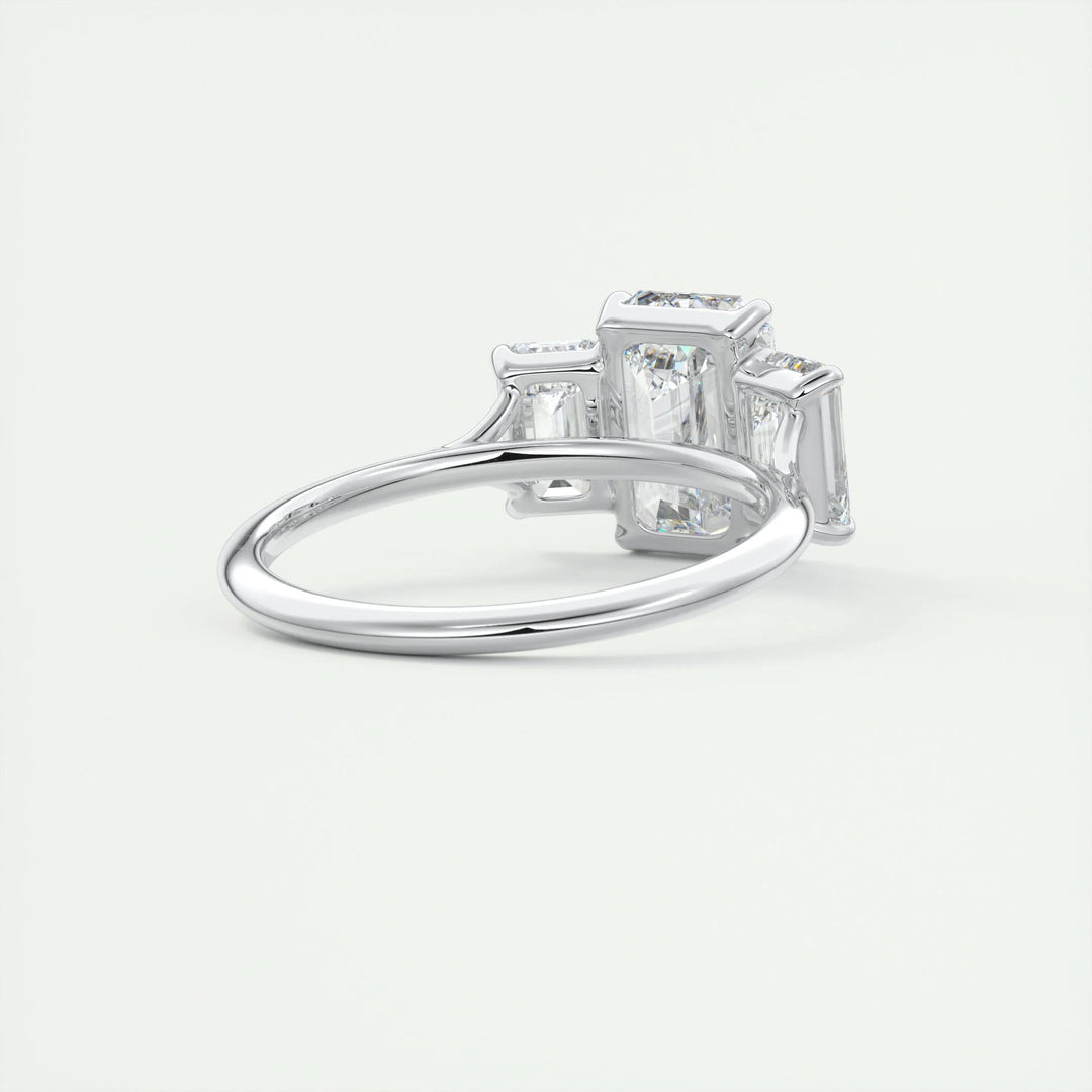 Emerald three stone engagement ring with brilliant diamond sparkle
