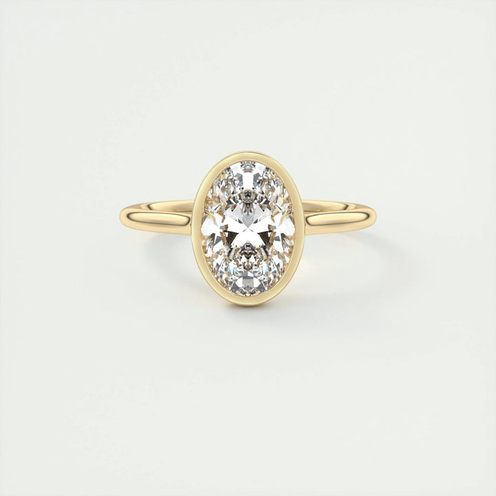Oval cut bezel engagement ring shown in real-life wear