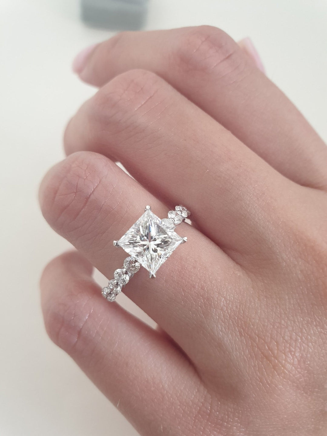 Princess pave engagement ring close-up showing D-VS1 diamond clarity