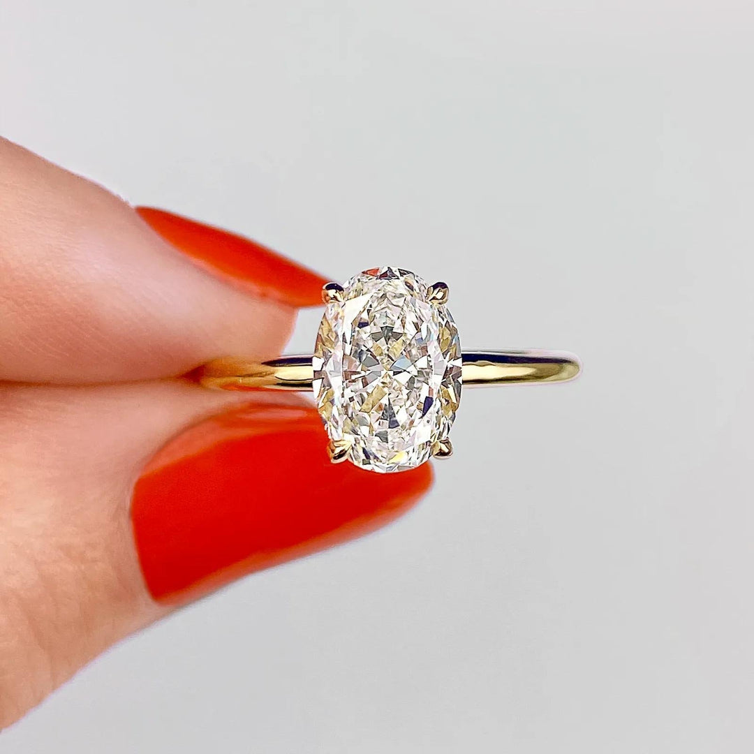 Oval solitaire lab grown diamond ring side profile in gold setting