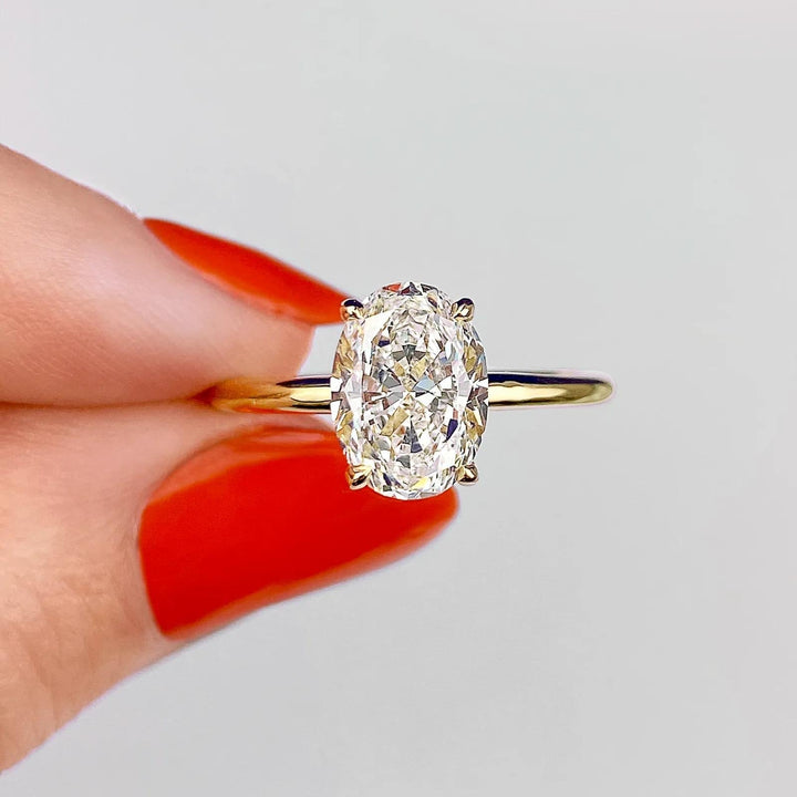 Oval solitaire lab grown diamond ring side profile in gold setting