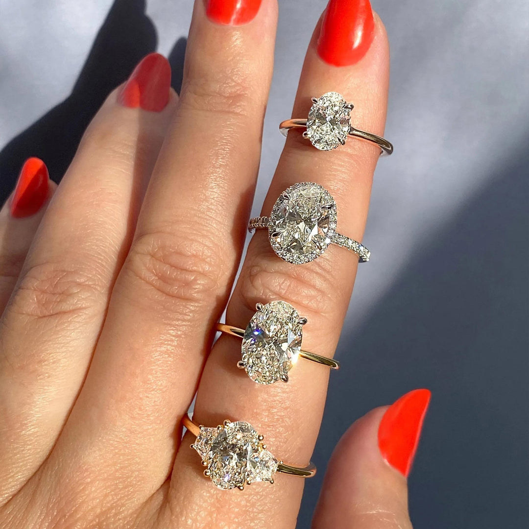 Oval cut engagement ring shown with authenticity certificate