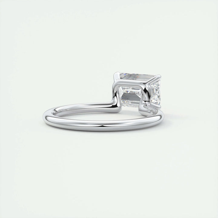 Detailed close-up of emerald solitaire diamond engagement ring