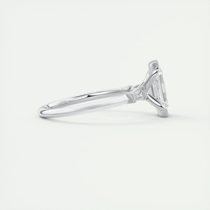 Fine craftsmanship detail on emerald three stone engagement ring