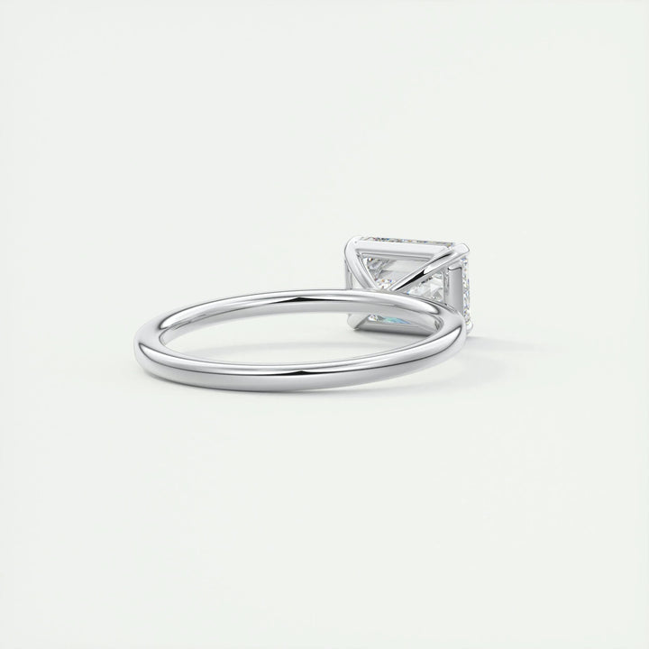 Emerald cut east west engagement ring shown in real-life wear