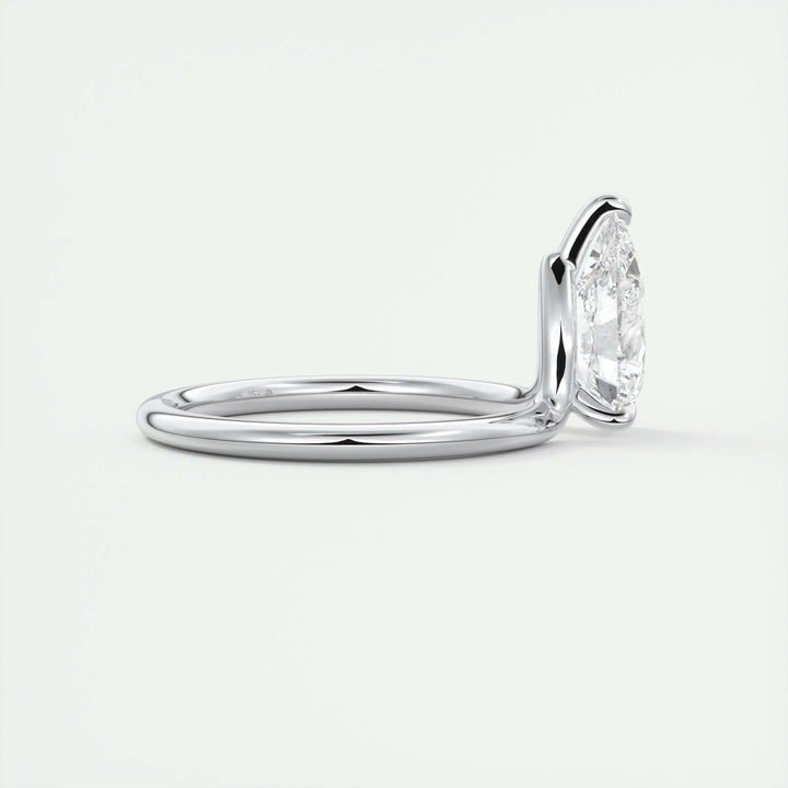 Pear solitaire engagement ring finished in polished solid gold