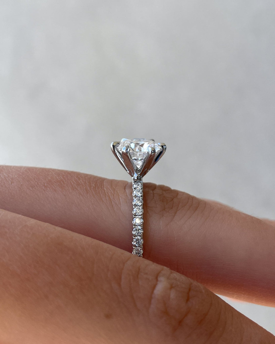 Side angle of round pave diamond engagement ring