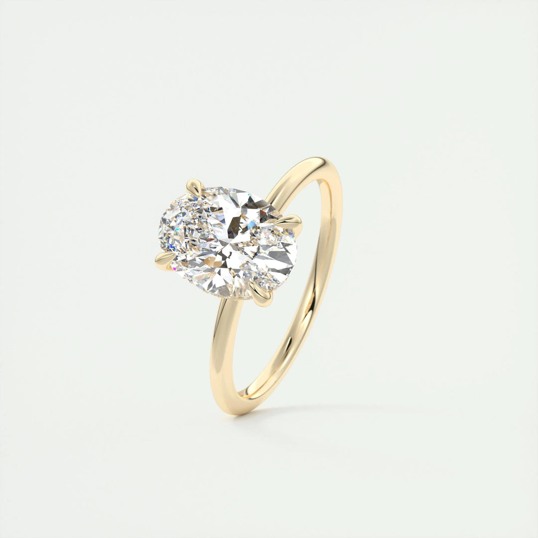 Oval hidden halo engagement ring close-up showing F-/VS1 diamond clarity
