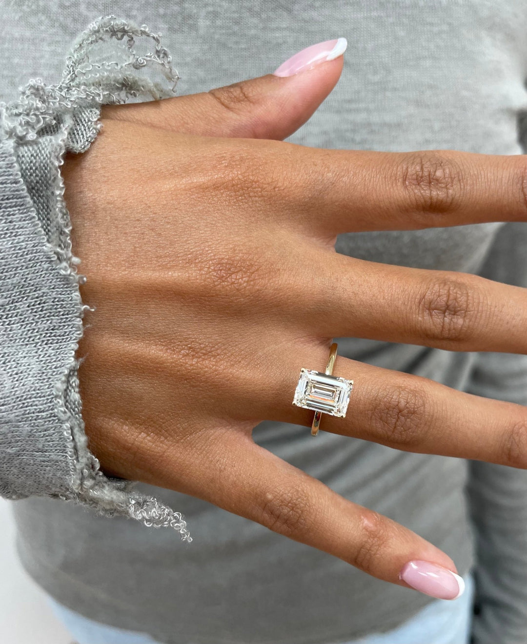 Emerald cut engagement ring side view showing band detail