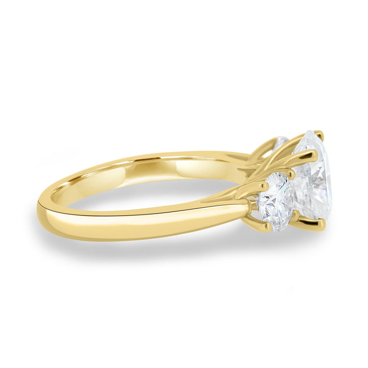 Oval three stone lab grown diamond ring side profile in gold setting
