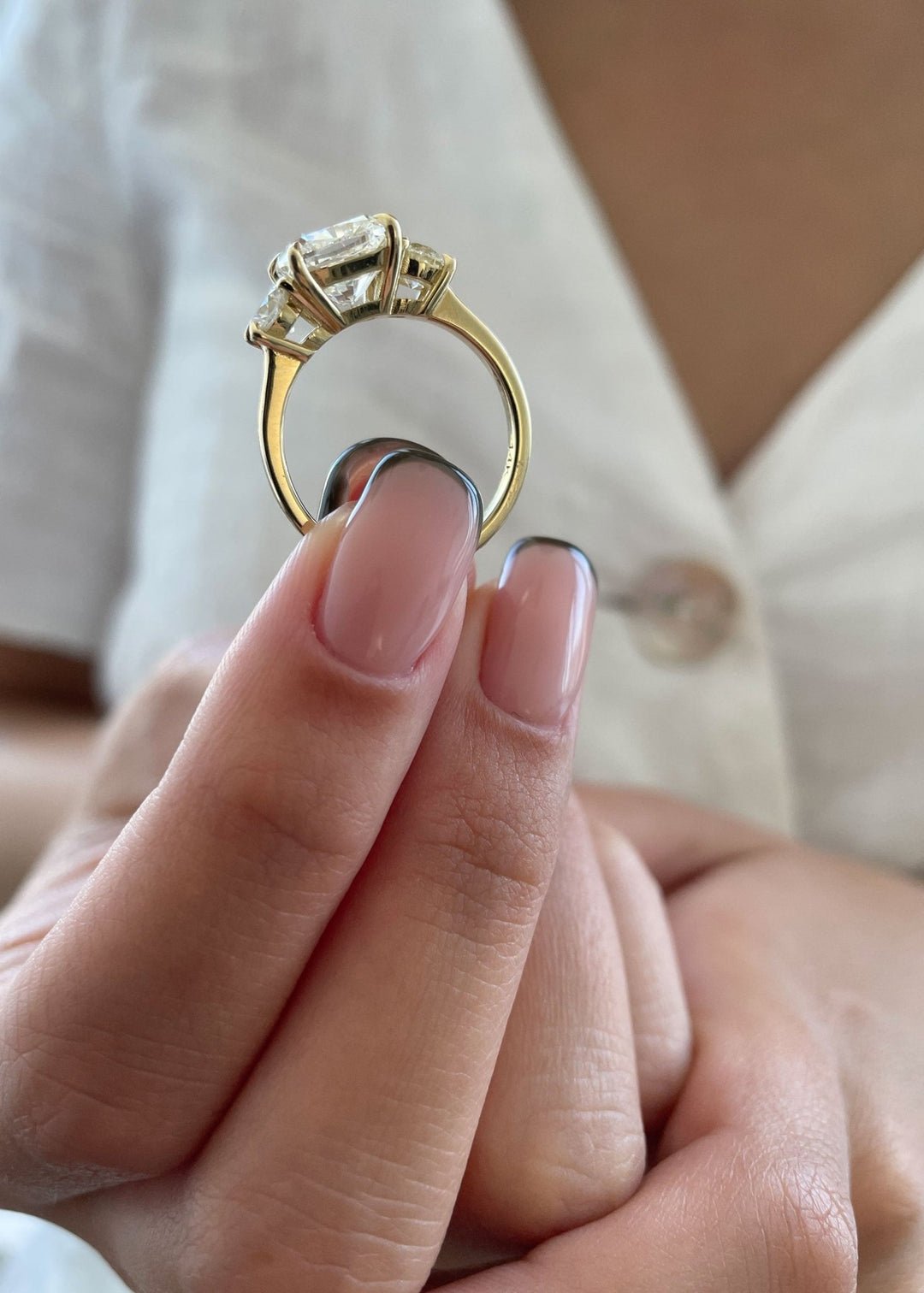 Classic cushion three stone engagement ring crafted for everyday wear