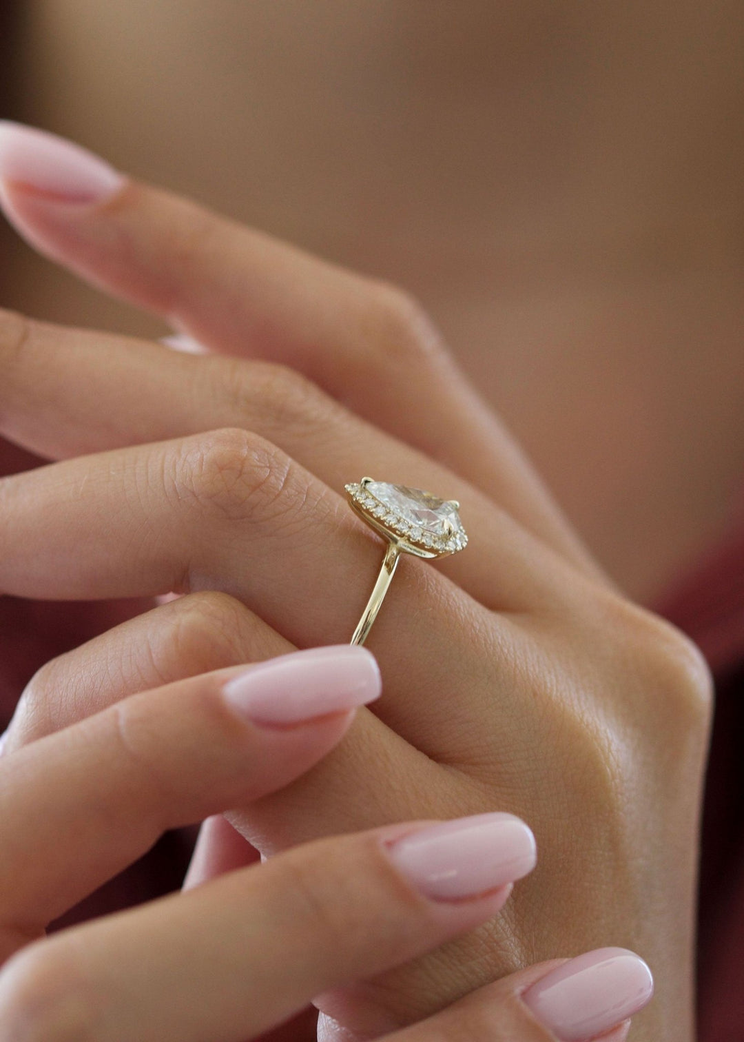 Pear halo diamond ring presented in signature gift packaging