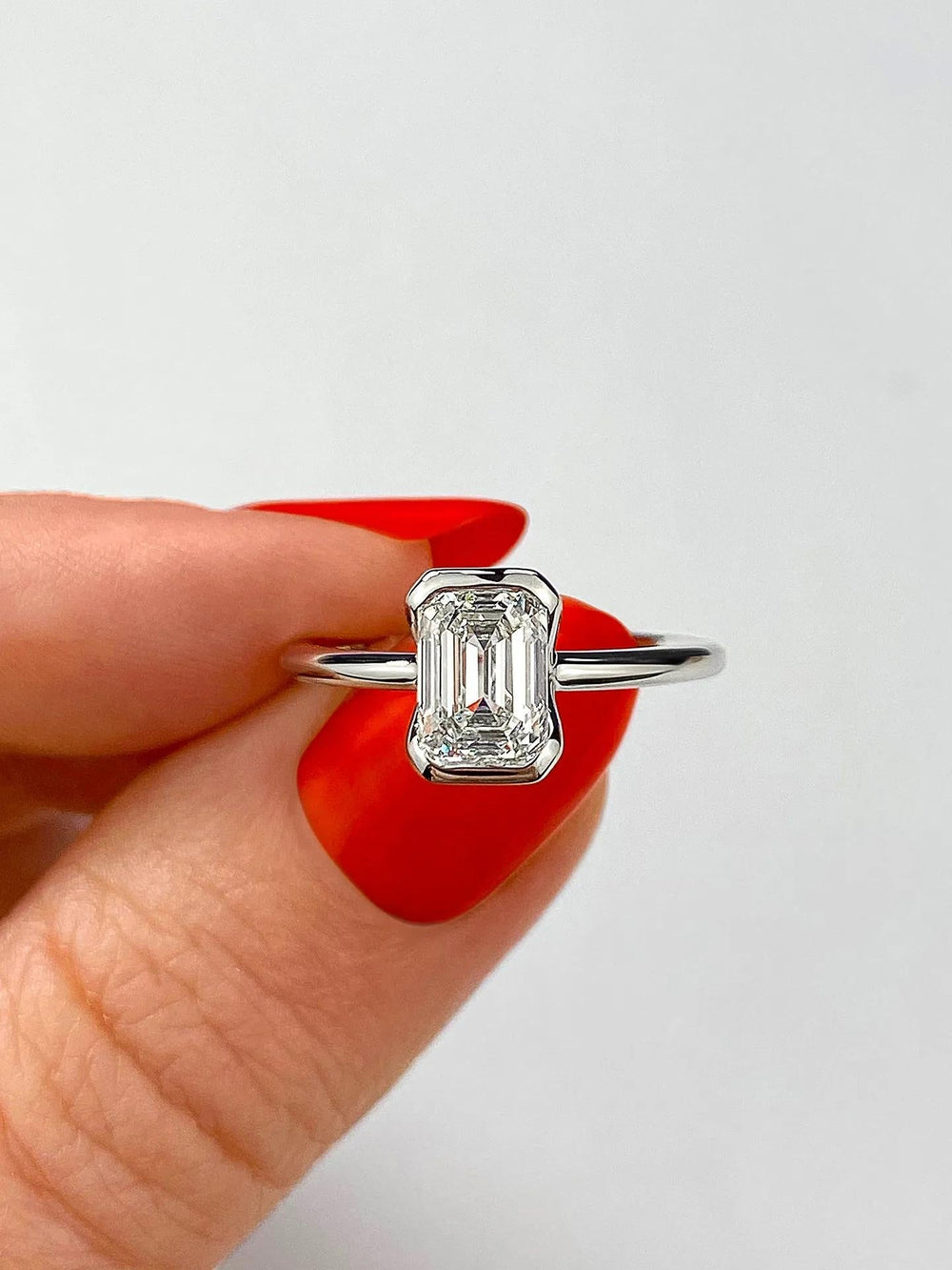 Premium emerald cut solitaire engagement ring crafted in solid gold