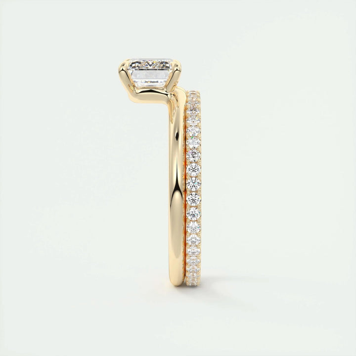 Emerald cut solitaire engagement ring shown in real-life wear