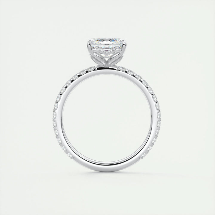 Macro shot of asscher cut diamond facets in pave ring setting